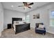 Bedroom with dark wood furniture, ceiling fan, and natural light at 3072 W Glacier Dr, Monrovia, IN 46157