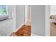 Hallway with hardwood floors leading to bedroom and bathroom at 3072 W Glacier Dr, Monrovia, IN 46157