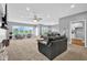 Spacious open-concept living room with plush carpeting and plenty of natural light at 3072 W Glacier Dr, Monrovia, IN 46157