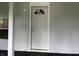 Welcoming front porch featuring a stylish front door with decorative glass and neutral colors at 3127 E Lynn St, Anderson, IN 46016