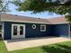 Spacious back patio accessible through elegant French doors, perfect for outdoor entertaining at 321 S 23Rd St, Elwood, IN 46036
