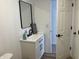 Bathroom with a modern vanity, sleek mirror, and stylish décor at 321 S 23Rd St, Elwood, IN 46036