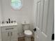 Charming bathroom with modern fixtures, white vanity, and bright octagon window at 321 S 23Rd St, Elwood, IN 46036