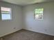 Carpeted bedroom featuring two windows offering bright natural light at 321 S 23Rd St, Elwood, IN 46036