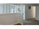 Image shows open foyer with white walls and trim, with a view of the front door at 321 S 23Rd St, Elwood, IN 46036