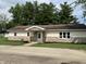 Charming single story home featuring stone facade and cozy front porch at 321 S 23Rd St, Elwood, IN 46036