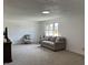 Bright and airy living room with new carpet, neutral walls, and comfortable seating at 321 S 23Rd St, Elwood, IN 46036