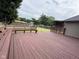 Expansive back deck with built-in bench seating overlooks the lovely, tree-lined backyard at 3327 Boxwood Dr, Indianapolis, IN 46227