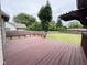 Spacious back deck offers built-in seating and a large yard, perfect for outdoor enjoyment at 3327 Boxwood Dr, Indianapolis, IN 46227