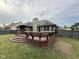 Backyard view showcases the deck with built-in seating, perfect for outdoor entertainment at 3327 Boxwood Dr, Indianapolis, IN 46227
