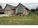 Charming brick home featuring an attached two-car garage and manicured lawn at 3327 Boxwood Dr, Indianapolis, IN 46227