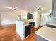 Kitchen with bar seating open to the living area with stainless appliances at 3327 Boxwood Dr, Indianapolis, IN 46227