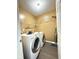 Functional laundry room with modern washer and dryer at 3327 Boxwood Dr, Indianapolis, IN 46227