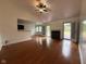 Open living area with hardwood floors, fireplace and French doors to the deck at 3327 Boxwood Dr, Indianapolis, IN 46227