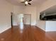 Open floor plan with hardwood floors connecting the living room and kitchen at 3327 Boxwood Dr, Indianapolis, IN 46227