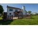 The backyard features a wooden deck with a pergola, and green lawn at 3610 Homestead Pl, Plainfield, IN 46168
