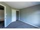 This bedroom includes neutral walls, closet with shelving, and carpeted floors at 3610 Homestead Pl, Plainfield, IN 46168