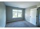The bedroom features neutral walls, carpeted floors, and a bright window at 3610 Homestead Pl, Plainfield, IN 46168