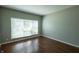 Bright bedroom with large window and hardwood floors at 3610 Homestead Pl, Plainfield, IN 46168
