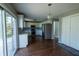 Spacious kitchen with white cabinets, stainless steel appliances, and sliding glass doors to the deck at 3610 Homestead Pl, Plainfield, IN 46168