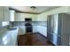 Modern kitchen featuring stainless steel appliances, white cabinets, and stylish countertops at 3610 Homestead Pl, Plainfield, IN 46168