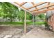 Spacious backyard with a partially-covered patio and ample green space, perfect for outdoor activities and relaxation at 3636 Oakwood Dr, Anderson, IN 46011