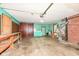 Spacious garage with ample storage, workspace, and potential for various uses at 3636 Oakwood Dr, Anderson, IN 46011