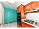 Kitchen featuring wooden cabinets, stainless appliances, and bright lighting at 3636 Oakwood Dr, Anderson, IN 46011
