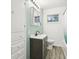Bathroom includes a vanity sink, storage, and combined shower and tub at 3921 S Lasalle St, Indianapolis, IN 46237