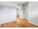 Empty bedroom features hardwood floors, an open closet, and neutral paint at 3921 S Lasalle St, Indianapolis, IN 46237