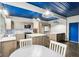 Bright eat-in kitchen features stainless appliances, an island, and a decorative backsplash at 3921 S Lasalle St, Indianapolis, IN 46237