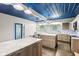 Spacious eat-in kitchen offers two islands with marble countertops, stainless appliances, and bright, natural light at 3921 S Lasalle St, Indianapolis, IN 46237