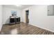 A modern laundry room with appliances and a stylish wood-look vinyl floor at 3921 S Lasalle St, Indianapolis, IN 46237