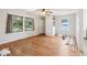 A cozy living room with hardwood floors, lots of natural light, and ceiling fan at 3921 S Lasalle St, Indianapolis, IN 46237