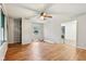 A bright living room features hardwood floors and multiple windows for lots of light at 3921 S Lasalle St, Indianapolis, IN 46237