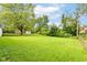 Large grassy backyard with mature trees and shed at 3965 Alsace Pl, Indianapolis, IN 46226