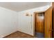 Simple bedroom with wall lighting and doorway to another space at 3965 Alsace Pl, Indianapolis, IN 46226