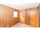 Bedroom with wooden paneling and a window for natural light at 3965 Alsace Pl, Indianapolis, IN 46226