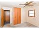 Bedroom with closet, and window, and outdated wallpaper at 3965 Alsace Pl, Indianapolis, IN 46226