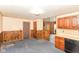 Functional kitchen area featuring wood cabinets and basic appliances at 3965 Alsace Pl, Indianapolis, IN 46226