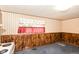 Modest kitchen with paneled walls, patterned wallpaper and cozy window at 3965 Alsace Pl, Indianapolis, IN 46226