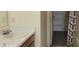Bathroom featuring a single vanity, and access to a linen closet at 403 Bagley Ln, Indianapolis, IN 46231