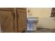 Bathroom with a toilet, cabinets, and bathtub at 403 Bagley Ln, Indianapolis, IN 46231