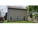 Exterior of the property showcasing tan siding, multiple windows and a sliding glass door to the backyard at 403 Bagley Ln, Indianapolis, IN 46231