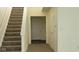 Foyer with stairs and neutral carpet at 403 Bagley Ln, Indianapolis, IN 46231