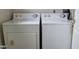 A laundry room equipped with both a washing machine and a dryer at 403 Bagley Ln, Indianapolis, IN 46231