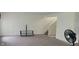 Open living space with neutral carpet and staircase to upper level at 403 Bagley Ln, Indianapolis, IN 46231
