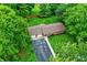 Aerial view of home with a long driveway, spacious yard and surrounding greenery at 4132 Tincher Rd, Indianapolis, IN 46221