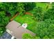 Expansive backyard features a wooden fence, deck, fire pit, and mature trees, providing a private outdoor retreat at 4132 Tincher Rd, Indianapolis, IN 46221