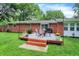 Charming brick home featuring a backyard deck, perfect for outdoor entertaining at 4132 Tincher Rd, Indianapolis, IN 46221